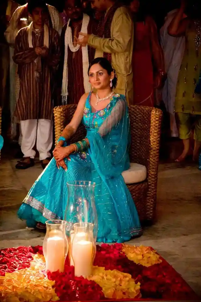 Bride seated during pre-wedding celebration at destination wedding venue